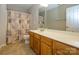 Well-lit bathroom with neutral walls, flooring and a shower curtain and vanity cabinet combo at 9031 Pembroke Ct, Indian Land, SC 29707