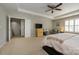 This comfortable bedroom features a ceiling fan, neutral carpet, and a window for natural light at 9031 Pembroke Ct, Indian Land, SC 29707