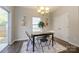 Cozy dining area featuring modern lighting, access to backyard patio, and neutral wall color at 9031 Pembroke Ct, Indian Land, SC 29707