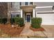 Inviting front entrance with blue door, stylish wreath, and manicured landscaping at 9031 Pembroke Ct, Indian Land, SC 29707