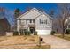 Charming two-story home with gray siding, blue shutters, and a well-manicured front yard at 9031 Pembroke Ct, Indian Land, SC 29707