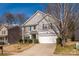 Charming two-story home with a well-manicured lawn and attached garage at 9031 Pembroke Ct, Indian Land, SC 29707