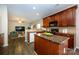 Open concept kitchen offering granite countertops, stainless steel appliances, and an island at 9031 Pembroke Ct, Indian Land, SC 29707