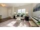 Bright living room with a sofa, large window, and stylish rug at 9031 Pembroke Ct, Indian Land, SC 29707