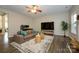 Spacious living room with large TV, fireplace, and comfortable seating at 9031 Pembroke Ct, Indian Land, SC 29707