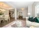 Open-concept living space with a dining area, staircase, and cozy seating arrangement at 9031 Pembroke Ct, Indian Land, SC 29707