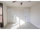 Bright and airy bedroom with neutral carpet and two doors at 10036 Paper Birch Dr, Charlotte, NC 28215