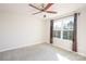 Bright and airy bedroom with neutral carpet and ceiling fan at 10036 Paper Birch Dr, Charlotte, NC 28215