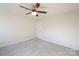 This is a cozy bedroom with a ceiling fan and neutral decor, perfect for relaxation at 10036 Paper Birch Dr, Charlotte, NC 28215