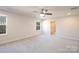 Spacious main bedroom with carpet, a ceiling fan, and an en-suite bathroom at 10036 Paper Birch Dr, Charlotte, NC 28215