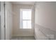 Bright walk-in closet features a window and multiple wire shelves at 10036 Paper Birch Dr, Charlotte, NC 28215