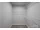 Empty walk-in closet with multiple wire shelves at 10036 Paper Birch Dr, Charlotte, NC 28215