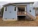 The back of a two-story house with a wooden deck and stairs at 107 Spring View Ln, Statesville, NC 28677