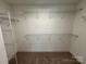 Walk-in closet with shelving for storage and organization, ready to be filled at 107 Spring View Ln, Statesville, NC 28677