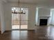 Dining area with hardwood floors, chandelier, and sliding glass doors to a deck at 107 Spring View Ln, Statesville, NC 28677