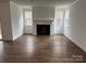 Bright living room featuring a fireplace and hardwood floors at 107 Spring View Ln, Statesville, NC 28677
