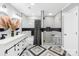 Modern bathroom featuring a double vanity, a soaking tub, a glass enclosed shower and stylish tile floors at 1075 Wellman St, Gastonia, NC 28054
