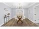 Cozy dining room with modern lighting, a glass table, stylish decor and a sliding glass door at 1075 Wellman St, Gastonia, NC 28054