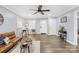 Bright living room featuring light gray walls, modern fan, and wood-look floors at 1075 Wellman St, Gastonia, NC 28054