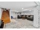 Finished basement with a staircase, carpet flooring, and a comfortable seating area at 111 Bethpage Rd, Kannapolis, NC 28081
