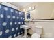 Bathroom with patterned tile flooring, pedestal sink, toilet and walk-in shower at 111 Bethpage Rd, Kannapolis, NC 28081