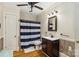 Bathroom featuring a wood vanity with a dark countertop, toilet and walk-in shower at 111 Bethpage Rd, Kannapolis, NC 28081