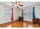 Bedroom featuring natural light from three windows and hardwood flooring at 111 Bethpage Rd, Kannapolis, NC 28081