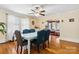 Bright dining room with a unique table, stylish chairs, and an adjacent living space at 111 Bethpage Rd, Kannapolis, NC 28081