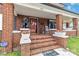 Charming brick front porch featuring lion statues, brick columns, and a welcoming entrance at 111 Bethpage Rd, Kannapolis, NC 28081