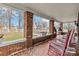 Covered porch featuring brick columns, mosaic tile flooring, and comfortable rocking chairs at 111 Bethpage Rd, Kannapolis, NC 28081
