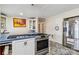 Bright kitchen featuring stainless steel appliances, patterned tile flooring and white cabinets with blue tile counters at 111 Bethpage Rd, Kannapolis, NC 28081