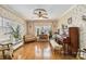 Elegant living room with hardwood floors, decorative wallpaper, and classic furnishings at 111 Bethpage Rd, Kannapolis, NC 28081