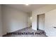 Bedroom with neutral carpet, a closet, and a view into the hallway at 1116 Kenly St, Salisbury, NC 28144