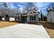 Attractive single-story home featuring gray siding, black shutters and a concrete driveway at 1116 Kenly St, Salisbury, NC 28144