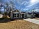 Neighborhood street view of new construction homes with grey siding, black shutters and concrete driveways at 1116 Kenly St, Salisbury, NC 28144