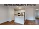 Clean and bright kitchen featuring stainless steel appliances, a breakfast bar and white cabinets at 1116 Kenly St, Salisbury, NC 28144