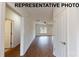 Bright living room features hardwood floors, a ceiling fan, and a window for natural light at 1116 Kenly St, Salisbury, NC 28144