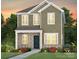 Charming two-story home with a brick and vinyl facade, complemented by a well-manicured front yard at 14036 Penbury Ln # 333, Charlotte, NC 28278