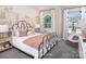 Charming bedroom with decorative mural, plush bedding, and bright, airy windows at 14722 Tamarack Dr, Charlotte, NC 28278