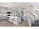 Modern kitchen featuring gray cabinets, stainless steel appliances, and a large island at 14722 Tamarack Dr, Charlotte, NC 28278
