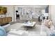 Spacious living area showcasing an open floor plan, modern decor, and a stylish kitchen at 14722 Tamarack Dr, Charlotte, NC 28278