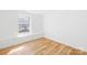 Bedroom with bright window and wood-look floors at 1641 Arlyn Cir # A, Charlotte, NC 28213