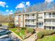 A well-maintained apartment building with balconies, manicured landscaping, and ample parking, showcasing the property at 1641 Arlyn Cir # A, Charlotte, NC 28213