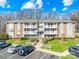 A well-maintained apartment building with balconies, landscaping, and ample parking, offering comfortable living at 1641 Arlyn Cir # A, Charlotte, NC 28213
