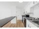 Kitchen area with breakfast bar and stainless steel appliances at 1641 Arlyn Cir # A, Charlotte, NC 28213