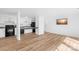 Living room with kitchen area and a mounted flatscreen television at 1641 Arlyn Cir # A, Charlotte, NC 28213