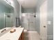 Bathroom featuring a vanity, tile floors, and a shower with sliding glass doors at 17137 Red Feather Dr, Charlotte, NC 28277