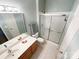 Bathroom featuring a vanity, tile floors, and a shower with sliding glass doors at 17137 Red Feather Dr, Charlotte, NC 28277