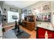 A gray room with a peloton, desk, and unique decorations on the wall at 17137 Red Feather Dr, Charlotte, NC 28277