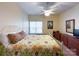 Well-lit bedroom with neutral walls, carpet, and a white iron bed frame at 17137 Red Feather Dr, Charlotte, NC 28277